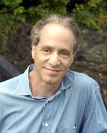 Ray Kurzweil speaking at a lectern