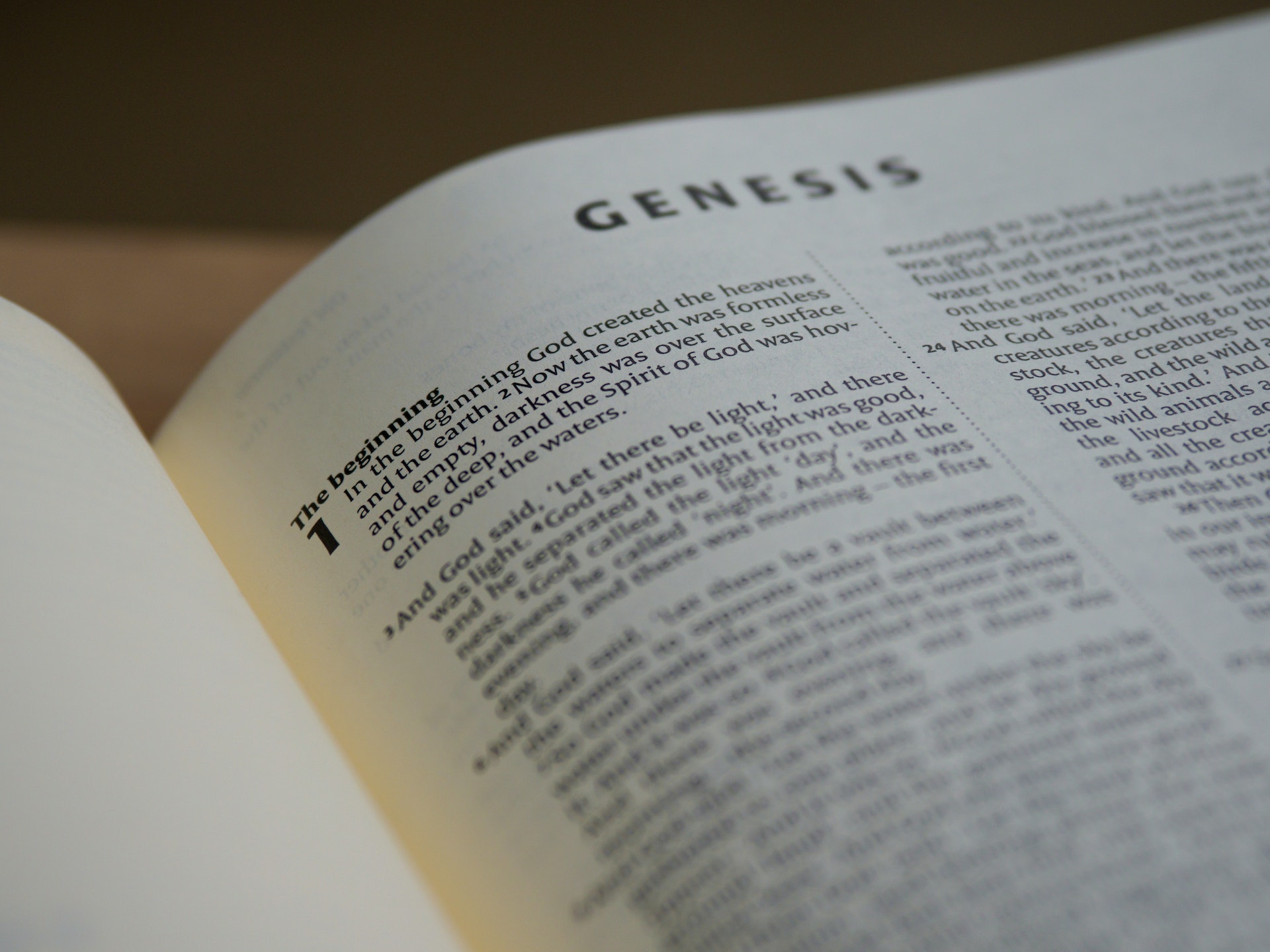An open Bible on a wooden surface