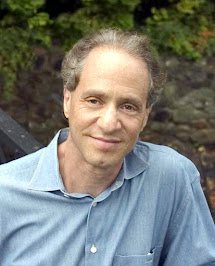 Ray Kurzweil speaking at a lectern